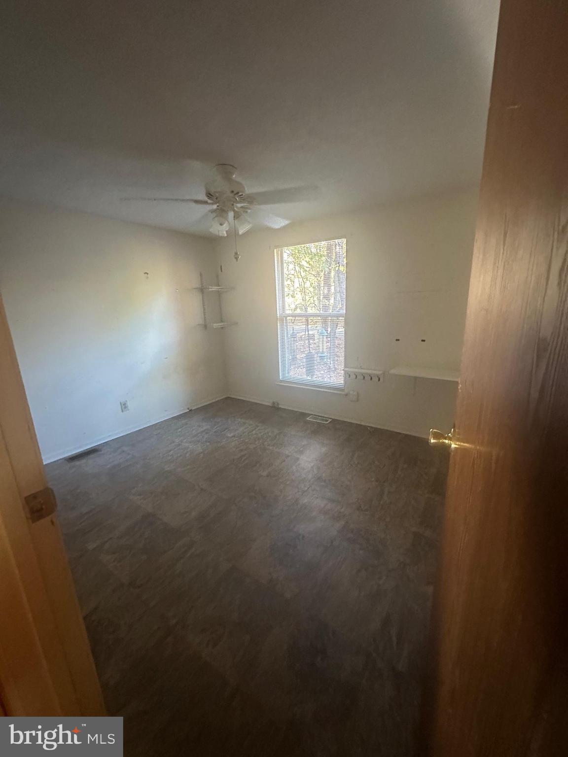12 Adams Court Marlton, NJ 08053 - Photo 8 of 15 an empty room with windows and ceiling fan view