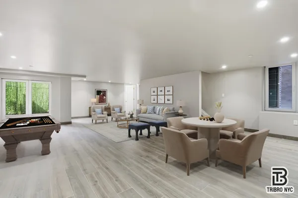 a living room with fireplace furniture and a window