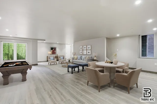 a living room with fireplace furniture and a window