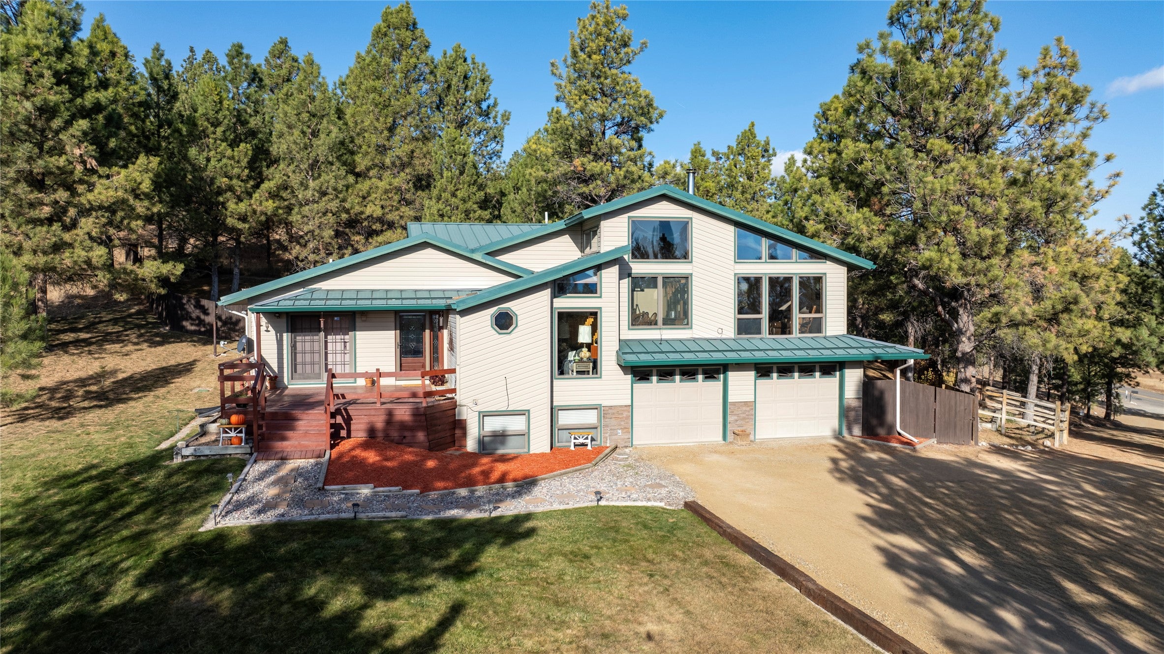 141 South Hills Road Clancy, MT 59634 - Photo 1 of 1 View of front of property featuring a front yard and a garage