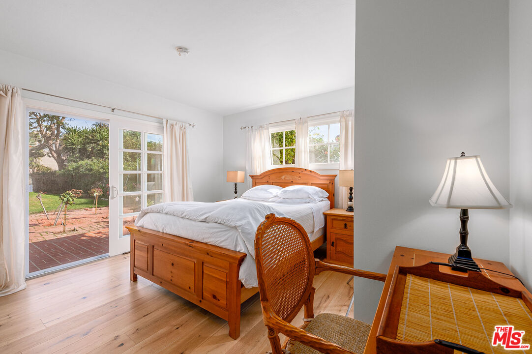 7016 Dume Drive Malibu, CA 90265 - Photo 16 of 24 a bed sitting in a bedroom next to a window