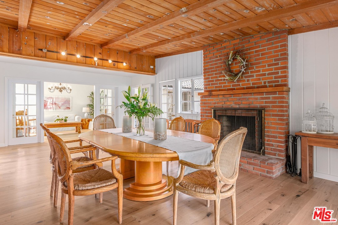 7016 Dume Drive Malibu, CA 90265 - Photo 10 of 24 a dining room with furniture and window