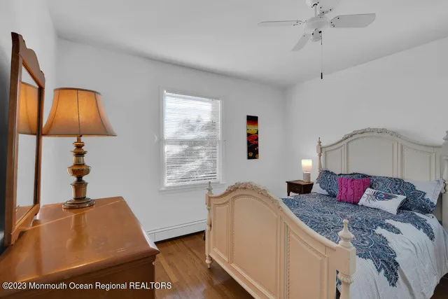 a bedroom with a bed and a lamp