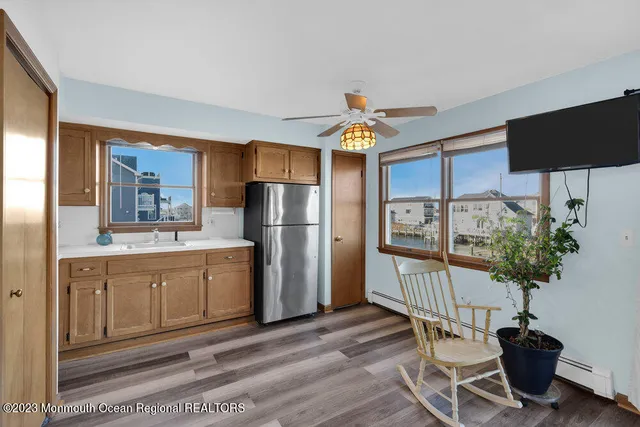 a kitchen with stainless steel appliances a refrigerator and a sink