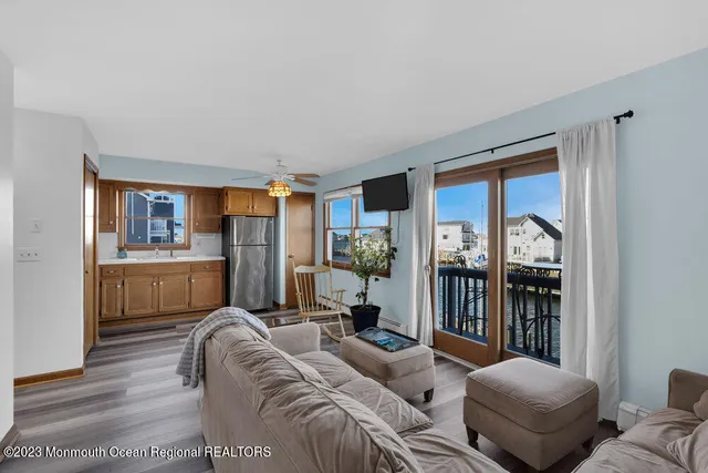 a living room with furniture and a area