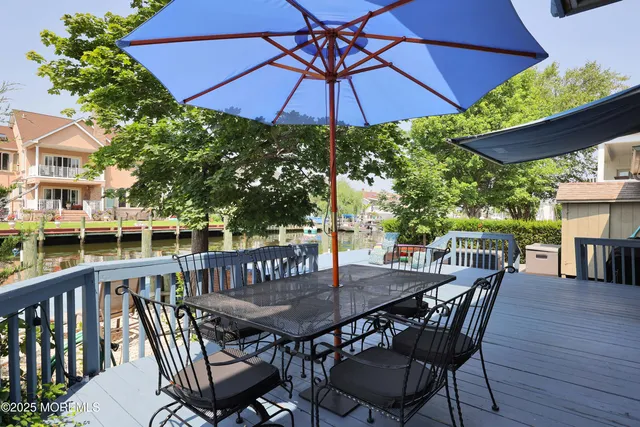 a view of a patio with couches and pool