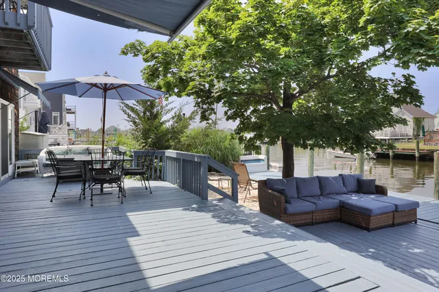 a view of a house with couches in the patio