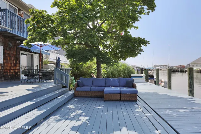 a view of a chair and tables in the terrace