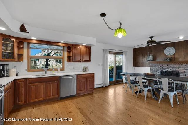 a large kitchen with lots of counter space and furniture