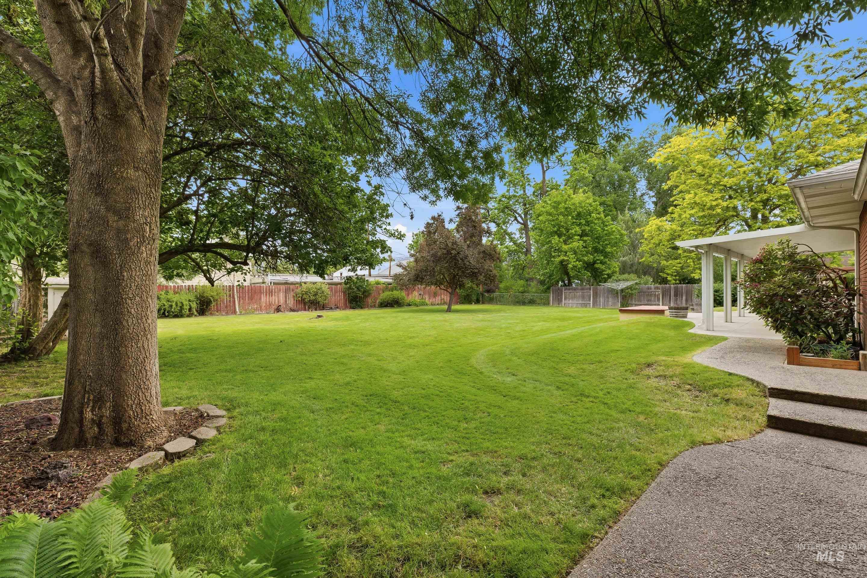 504 West Howe Street Boise, ID 83706 - Photo 45 of 47 Expansive private yard featuring mature trees and a manicured lawn