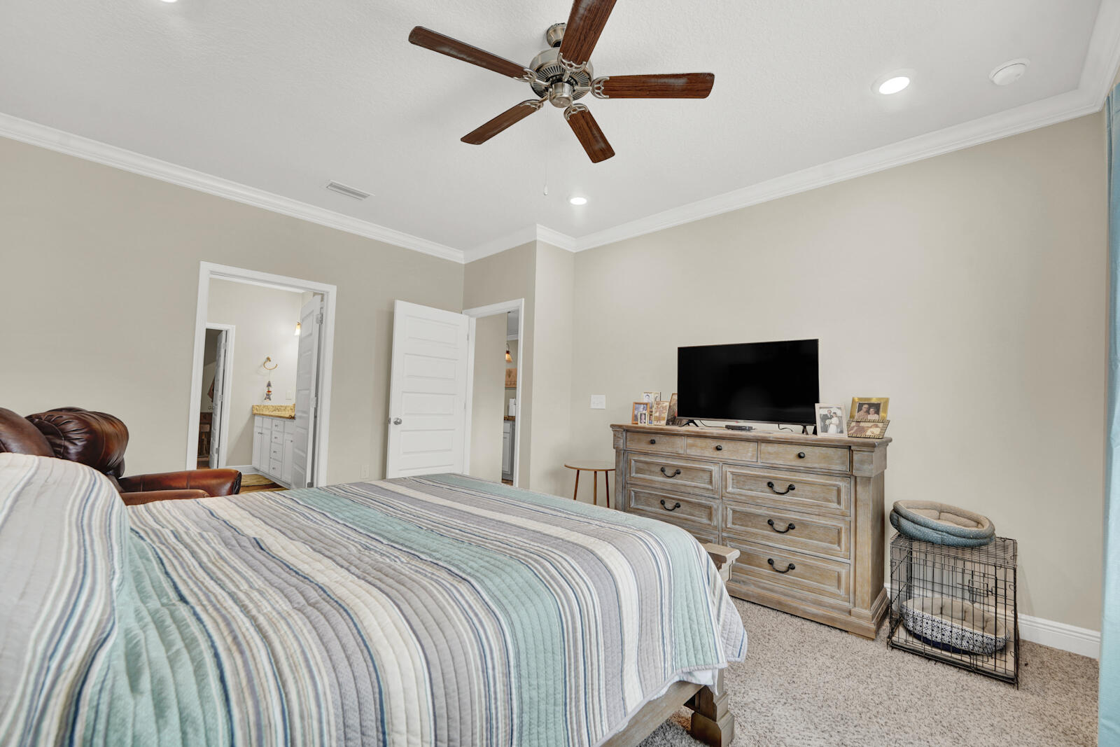 412 Lightning Bug Lane Freeport, FL 32439 - Photo 17 of 52 a bedroom with a bed and a flat screen tv