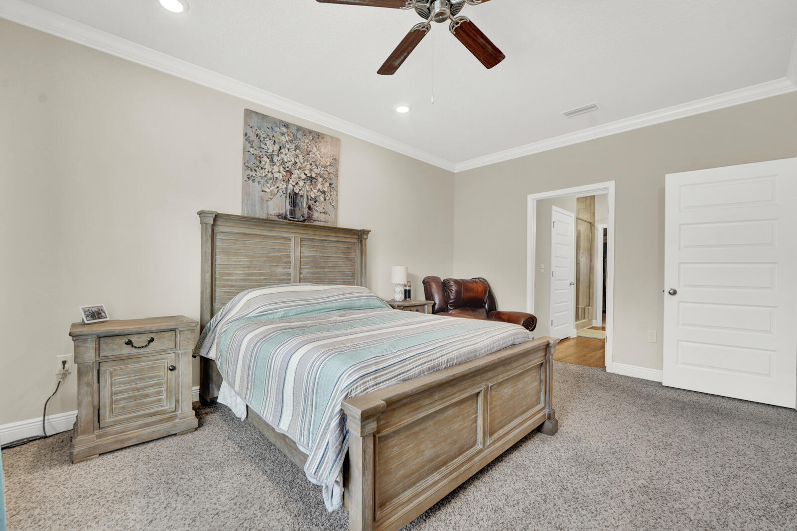 412 Lightning Bug Lane Freeport, FL 32439 - Photo 18 of 52 a bedroom with a bed and painting on the wall