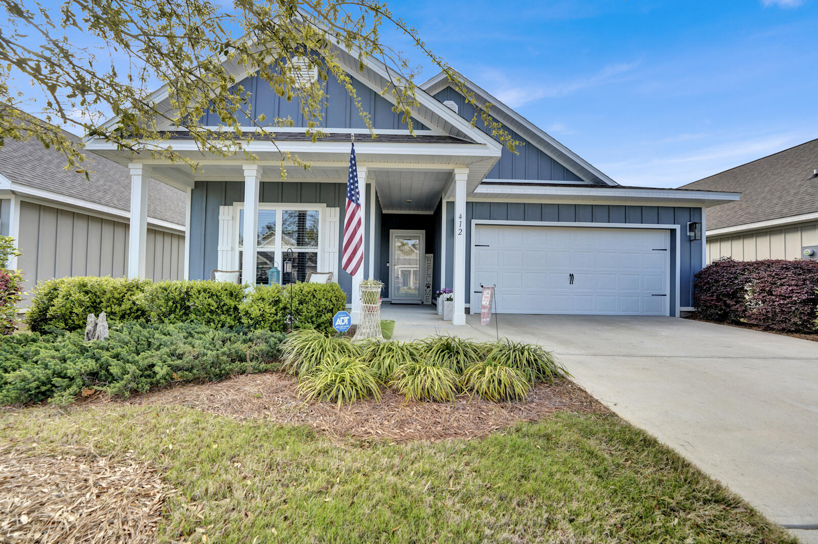 412 Lightning Bug Lane Freeport, FL 32439 - Photo 2 of 52 a front view of a house with a yard