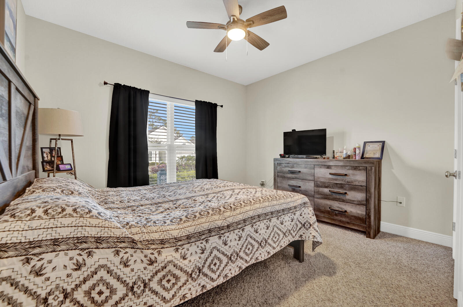 412 Lightning Bug Lane Freeport, FL 32439 - Photo 28 of 52 a bedroom with a bed and wooden floor