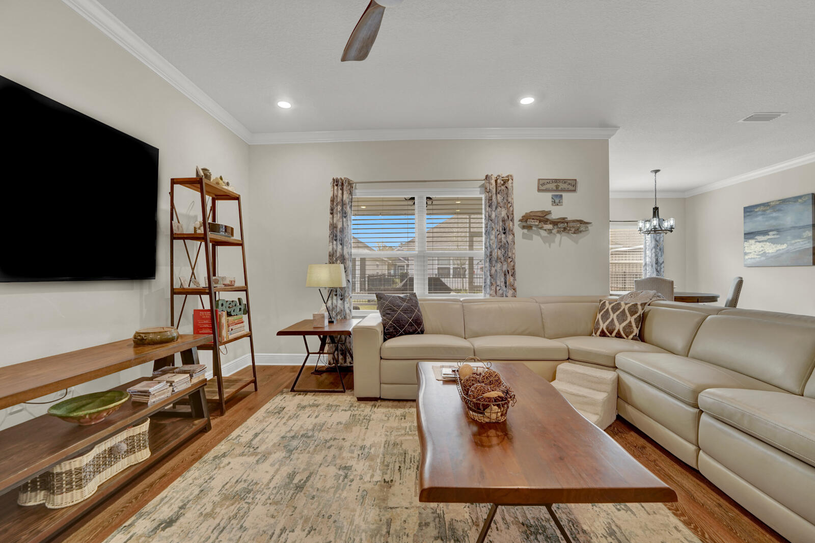 412 Lightning Bug Lane Freeport, FL 32439 - Photo 6 of 52 a living room with furniture and a flat screen tv