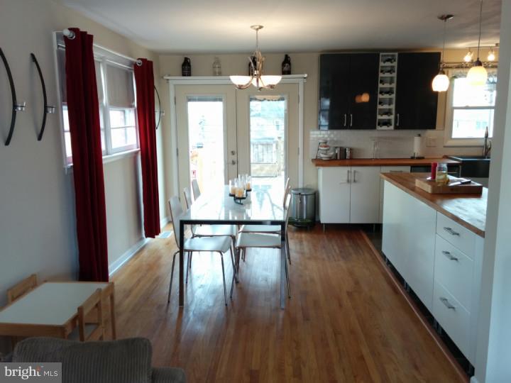 1241 Dill Road Havertown, PA 19083 - Photo 4 of 14 a kitchen with a table chairs refrigerator and cabinets