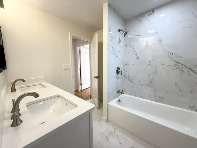 a bathroom with a sink and a bathtub
