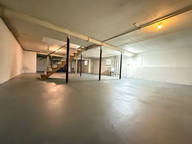 a view of a hall with wooden floor