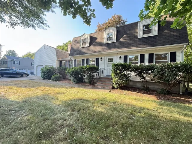 a swimming pool view with a seating space