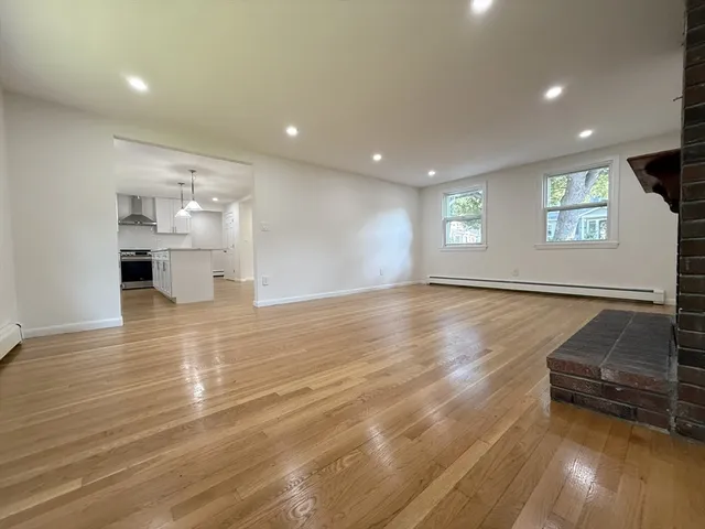 a view of a kitchen with a sink and a stove top oven