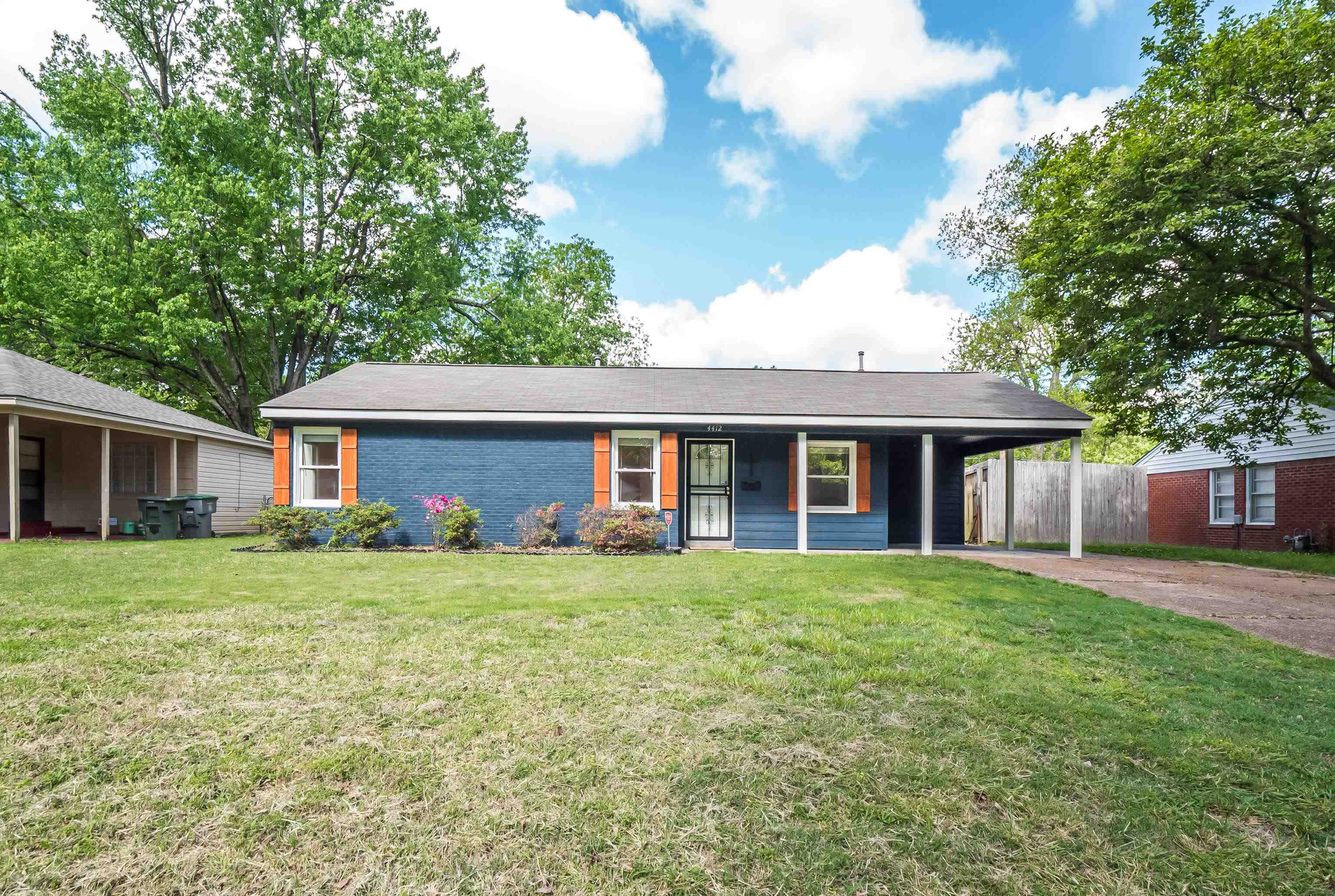 4412 Helene Road Memphis, TN 38117 - Photo 1 of 19 a front view of a house with a garden