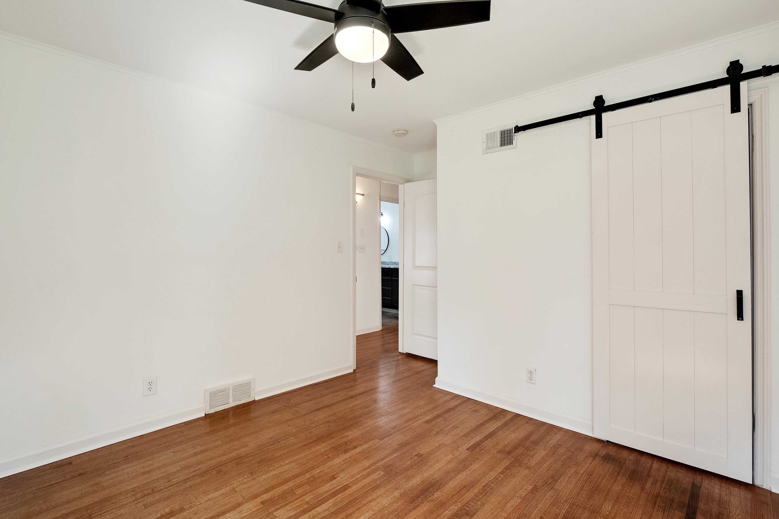 4412 Helene Road Memphis, TN 38117 - Photo 12 of 19 a view of an empty room with wooden floor