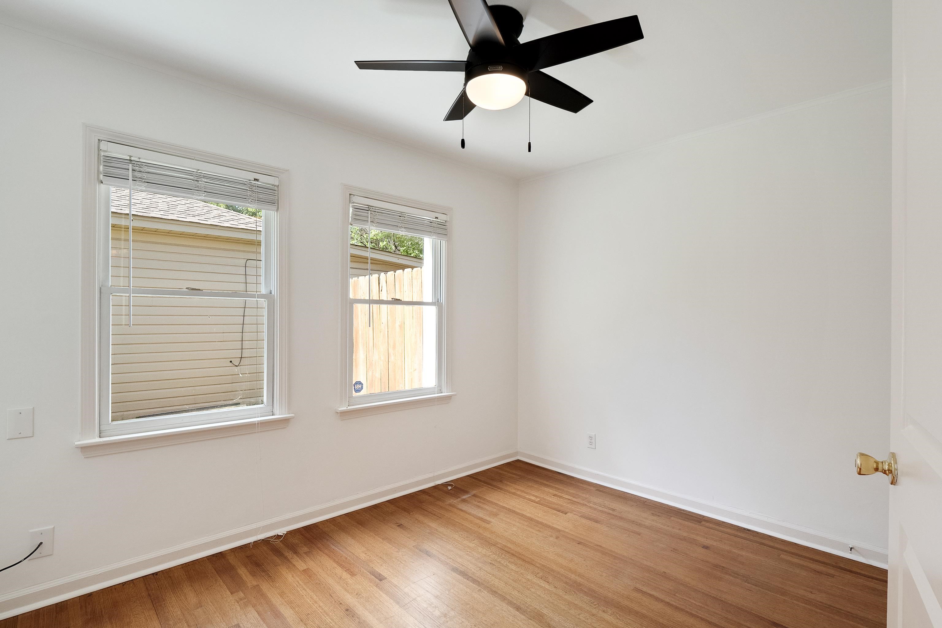 4412 Helene Road Memphis, TN 38117 - Photo 13 of 19 a view of an empty room with wooden floor and a window