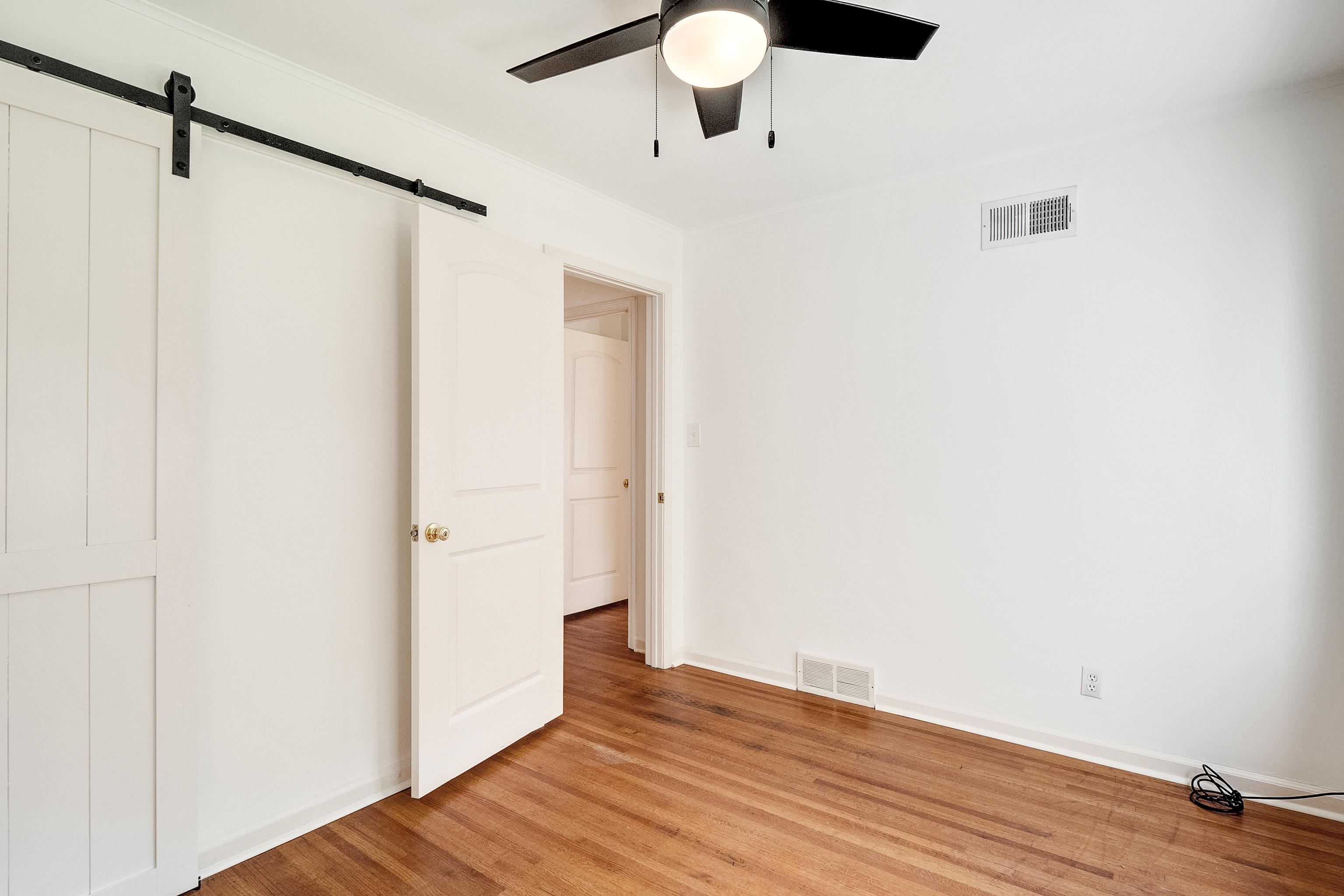 4412 Helene Road Memphis, TN 38117 - Photo 14 of 19 a view of an empty room with wooden floor