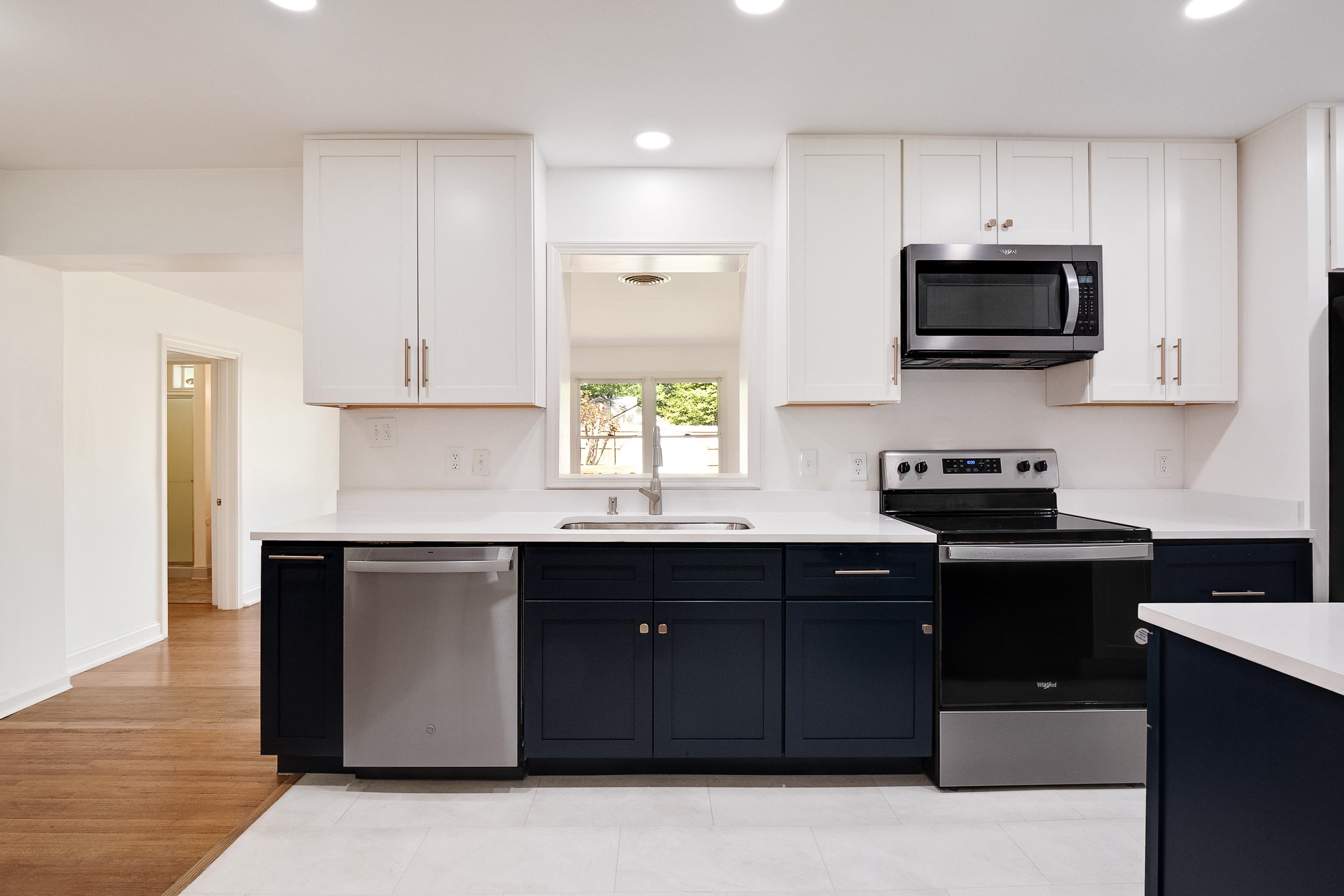 4412 Helene Road Memphis, TN 38117 - Photo 5 of 19 a kitchen with stainless steel appliances granite countertop a stove a sink and a microwave