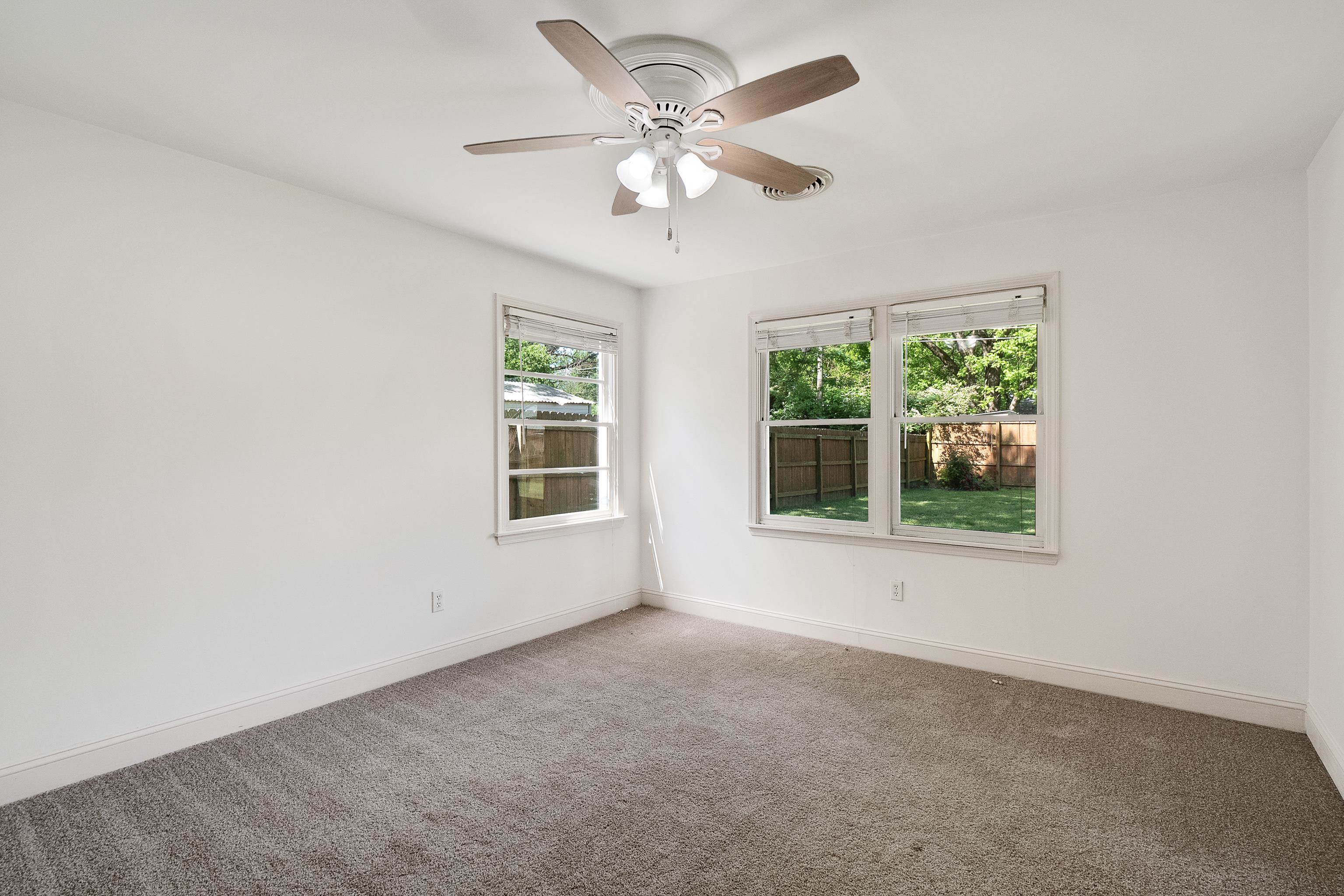4412 Helene Road Memphis, TN 38117 - Photo 8 of 19 an empty room with windows and fan