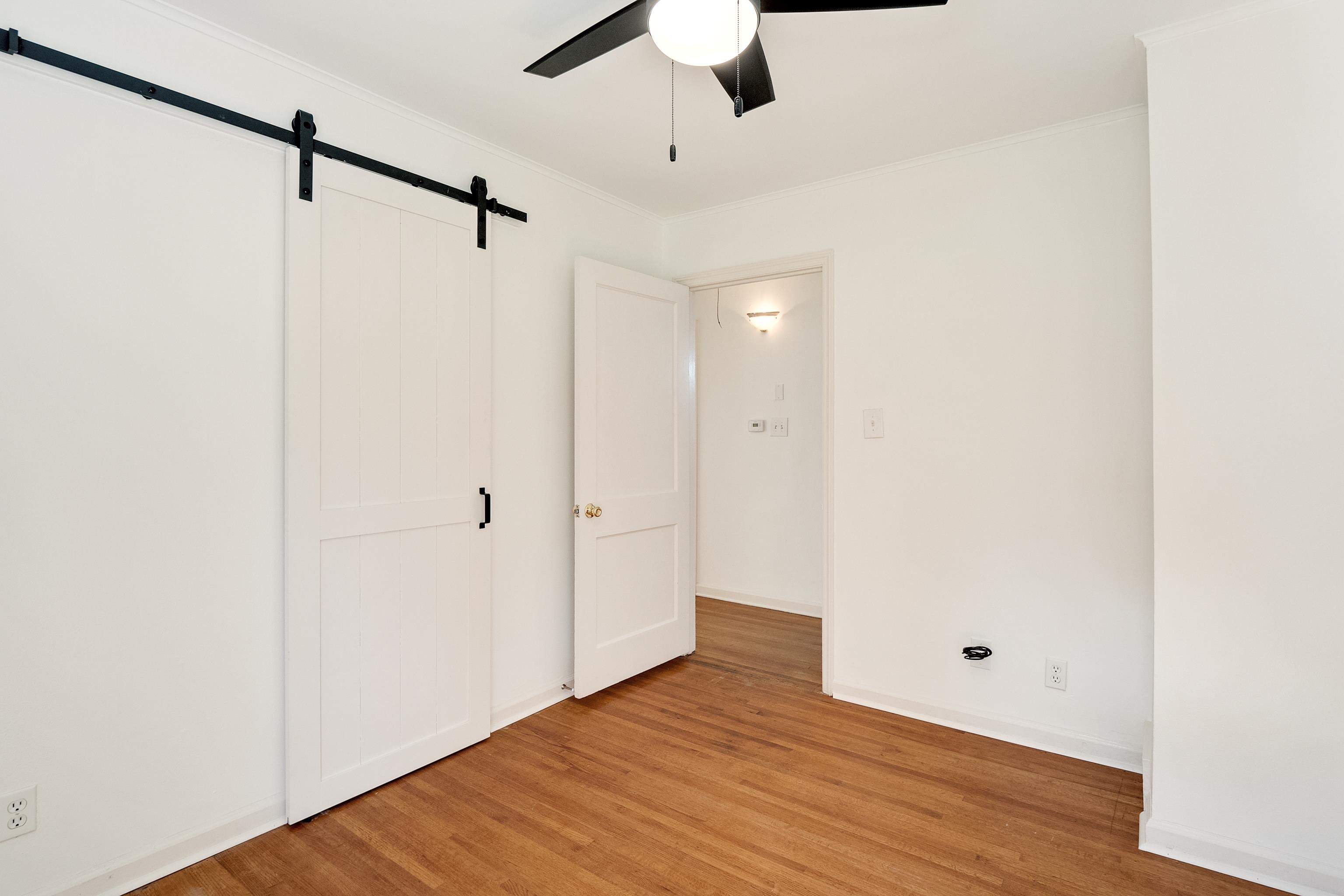 4412 Helene Road Memphis, TN 38117 - Photo 10 of 19 a view of an empty room with wooden floor