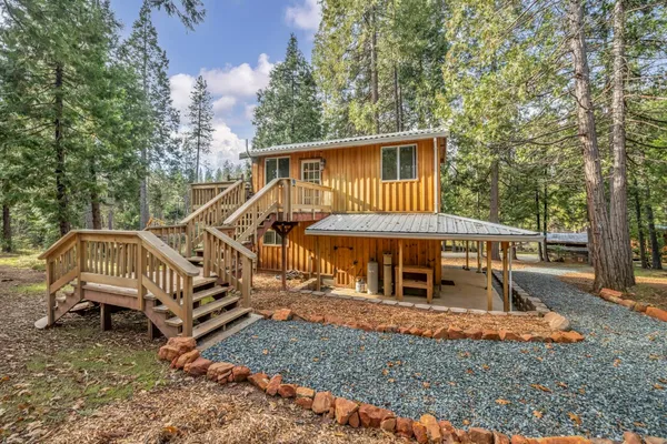 a view of outdoor space with deck and yard
