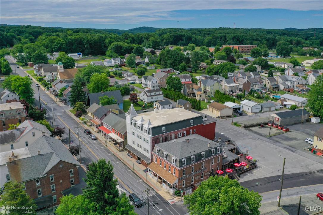 an aerial view of a house with a garden