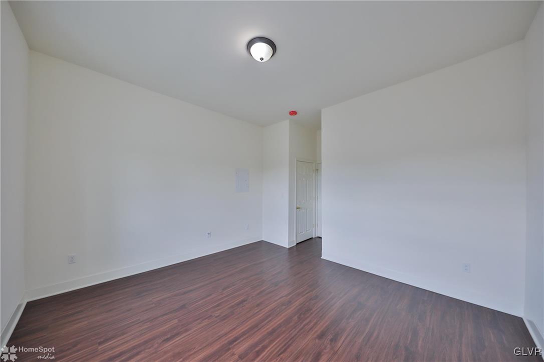 108 South Main Street, Unit 3A Alburtis, PA 18011 - Photo 11 of 35 a view of an empty room with wooden floor
