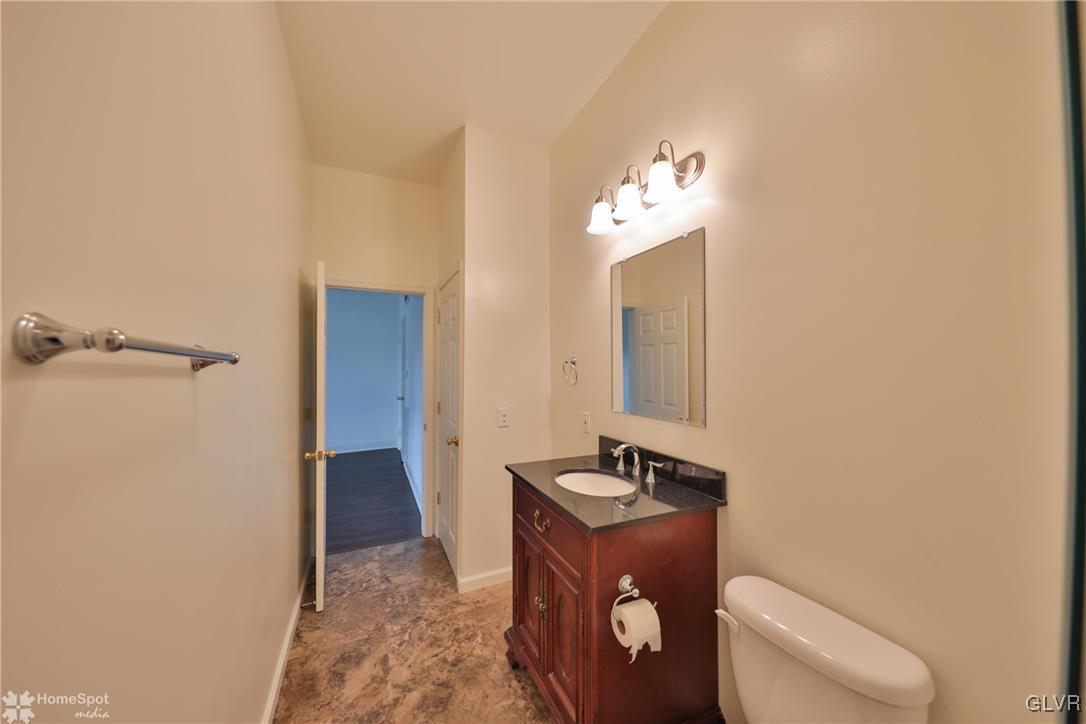 108 South Main Street, Unit 3A Alburtis, PA 18011 - Photo 15 of 35 a bathroom with a toilet sink and mirror