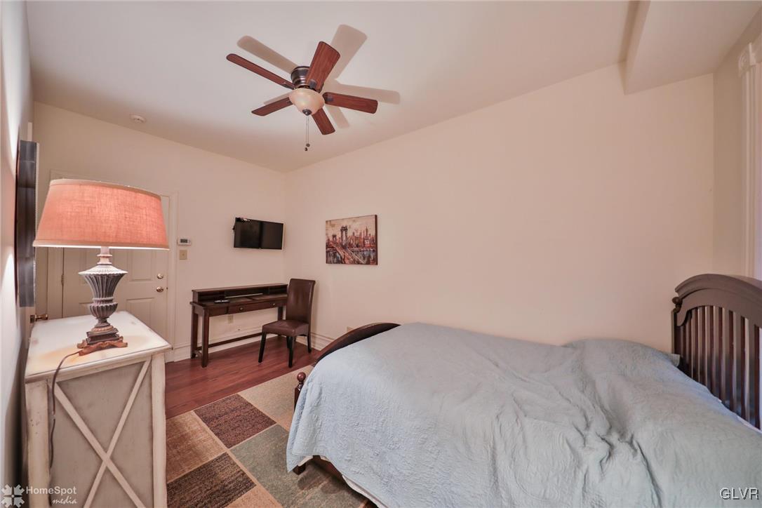 108 South Main Street, Unit 3A Alburtis, PA 18011 - Photo 22 of 35 a bedroom with a bed and a chair in it