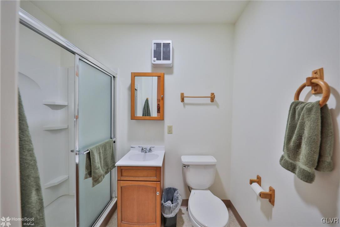 108 South Main Street, Unit 3A Alburtis, PA 18011 - Photo 24 of 35 a white toilet sitting next to a bathroom sink