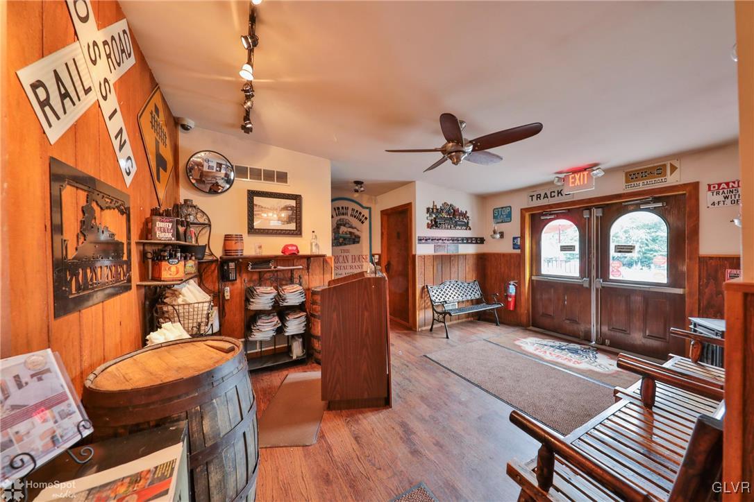 108 South Main Street, Unit 3A Alburtis, PA 18011 - Photo 25 of 35 a living room with furniture a fireplace and wooden floor