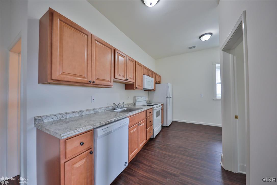 108 South Main Street, Unit 3A Alburtis, PA 18011 - Photo 7 of 35 a kitchen with a sink stove and cabinets