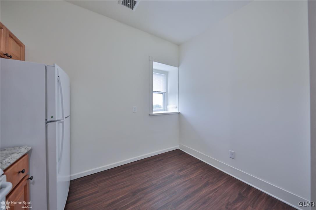 108 South Main Street, Unit 3A Alburtis, PA 18011 - Photo 8 of 35 an empty room with wooden floor and window