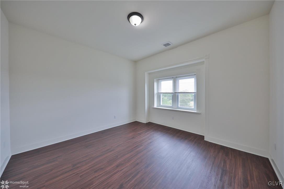 108 South Main Street, Unit 3A Alburtis, PA 18011 - Photo 10 of 35 an empty room with wooden floor and windows