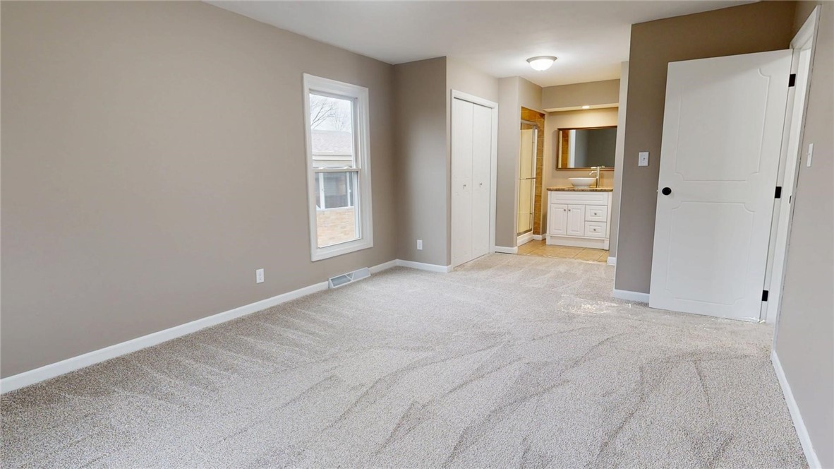 4153 Buckingham Drive Decatur, IL 62526 - Photo 18 of 34 a view of an empty room with a window
