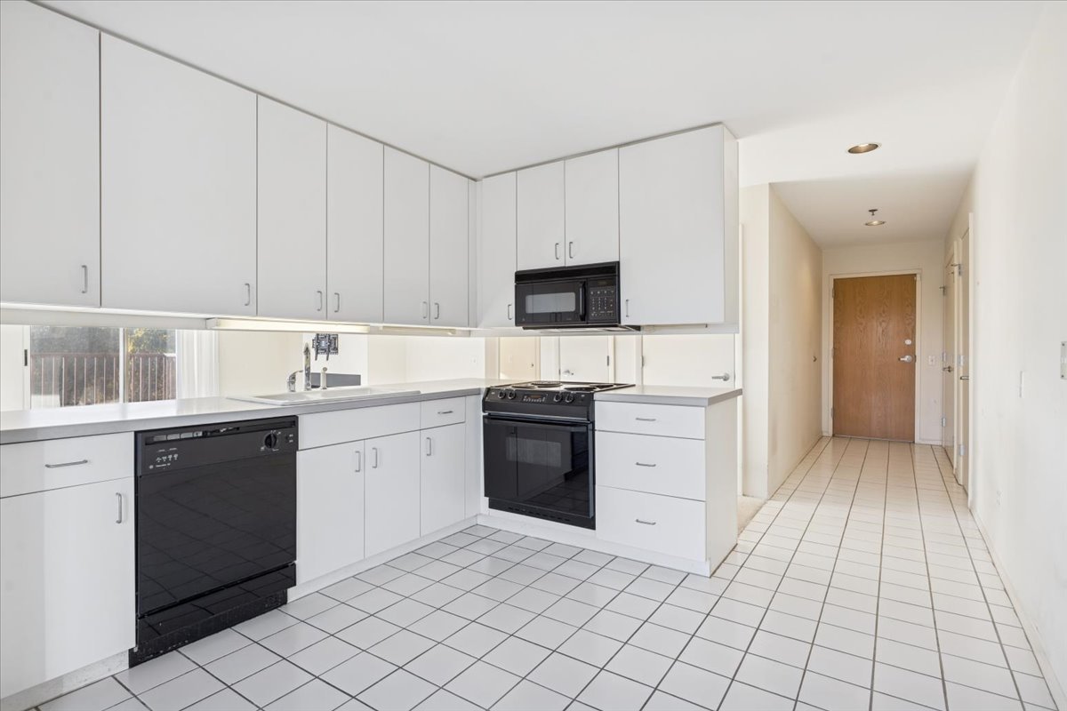 351 Kelburn Road, Unit 312 Deerfield, IL 60015 - Photo 11 of 33 a kitchen with a sink window and cabinets