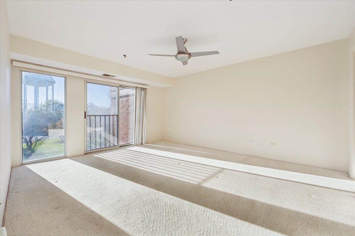 351 Kelburn Road, Unit 312 Deerfield, IL 60015 - Photo 14 of 33 a bedroom with a bed and a window