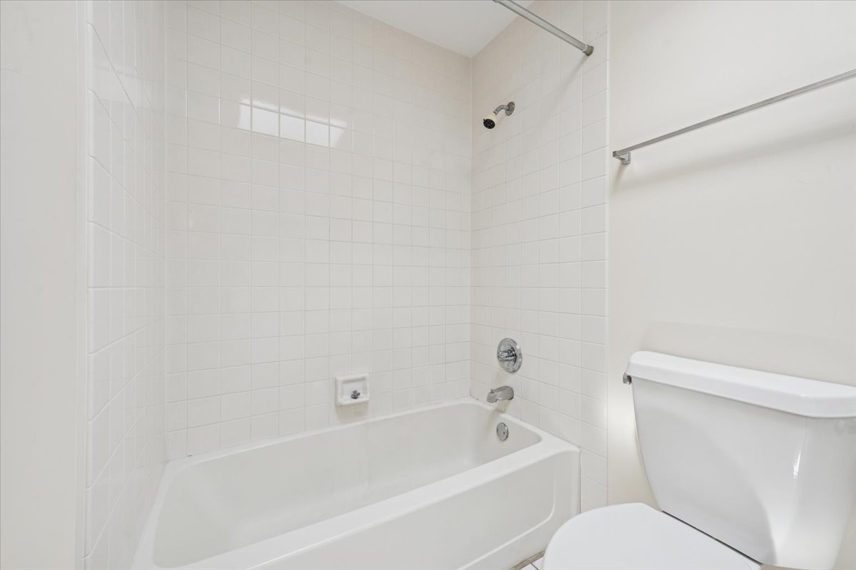 351 Kelburn Road, Unit 312 Deerfield, IL 60015 - Photo 17 of 33 a white bath tub sitting next to a white toilet and sink