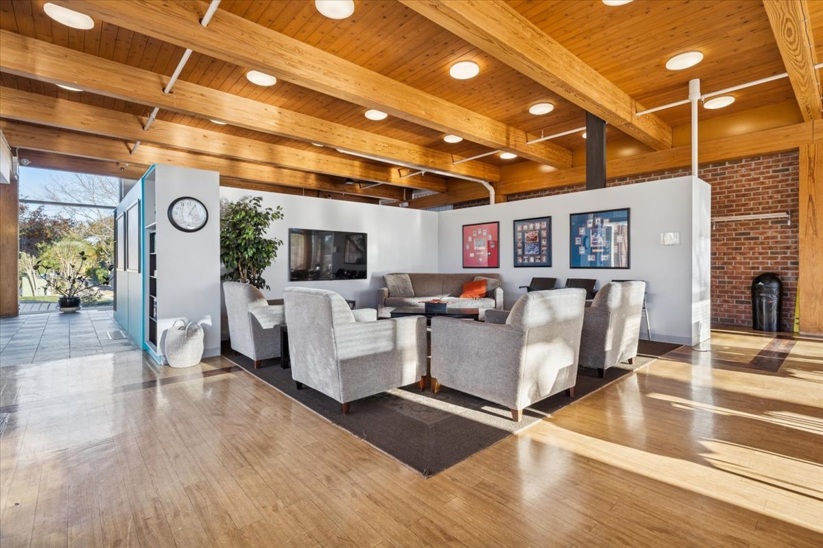 351 Kelburn Road, Unit 312 Deerfield, IL 60015 - Photo 29 of 33 a living room with furniture and a flat screen tv