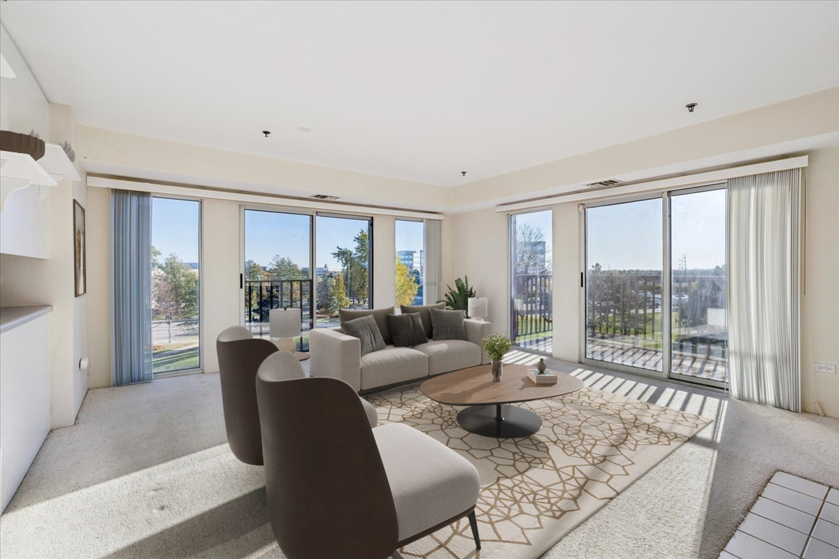 351 Kelburn Road, Unit 312 Deerfield, IL 60015 - Photo 4 of 33 a living room with furniture and a large window