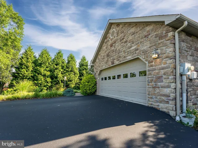 a kitchen with stainless steel appliances granite countertop white cabinets a stove and dishwasher