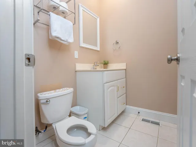 an aerial view of residential house with pool and outdoor seating