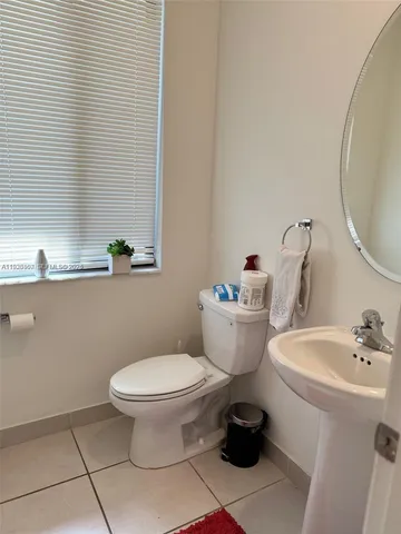 a bathroom with a toilet and a sink